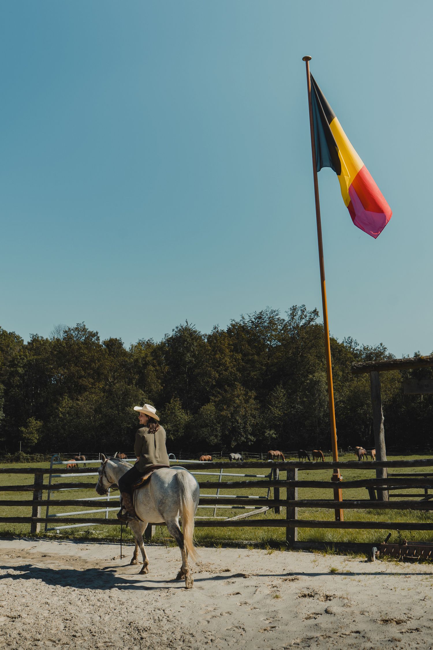 woman riding horse at ranch Branding, Belgium, james Glac Photography