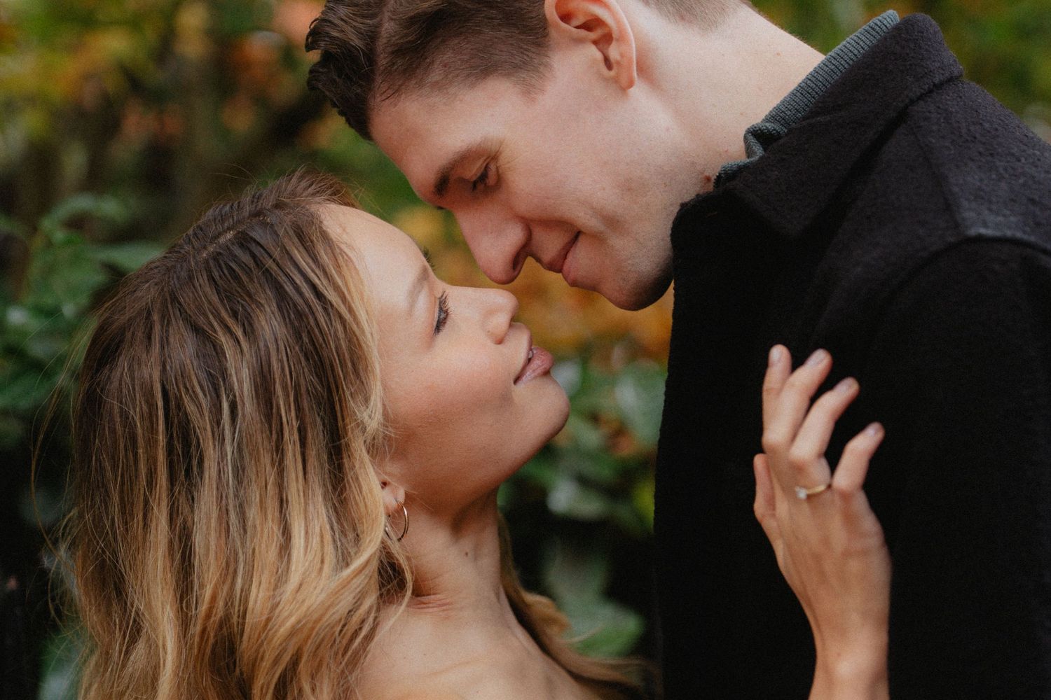 Intimate autumn portrait session with soft natural lighting.