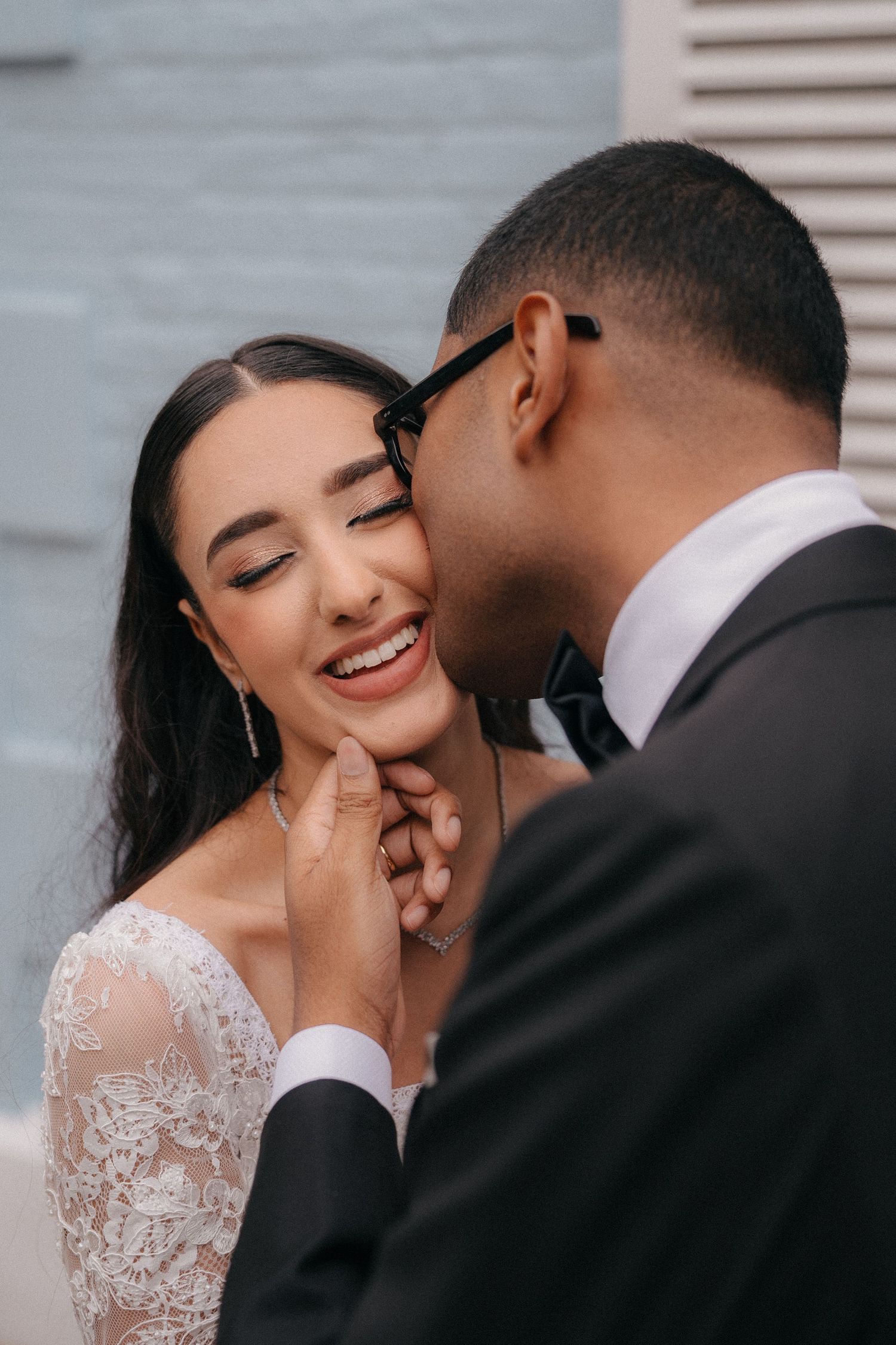 Tender romantic moment captured during wedding photoshoot.
