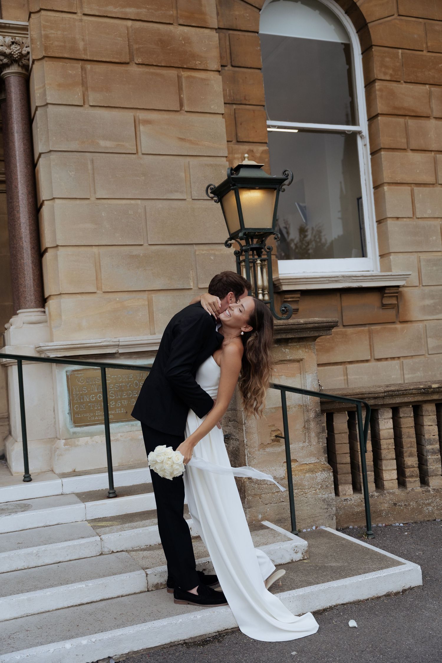 Wedding couple sharing romantic poses Bournemouth Town Hall wedding photographer