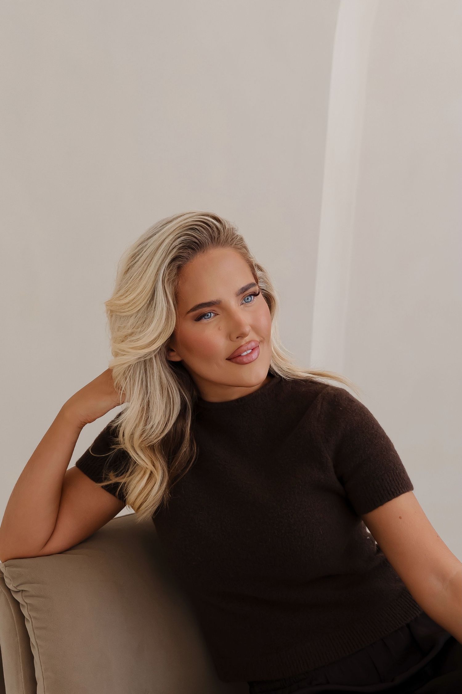 Portrait series showing natural expressions and black attire in studio setting.
