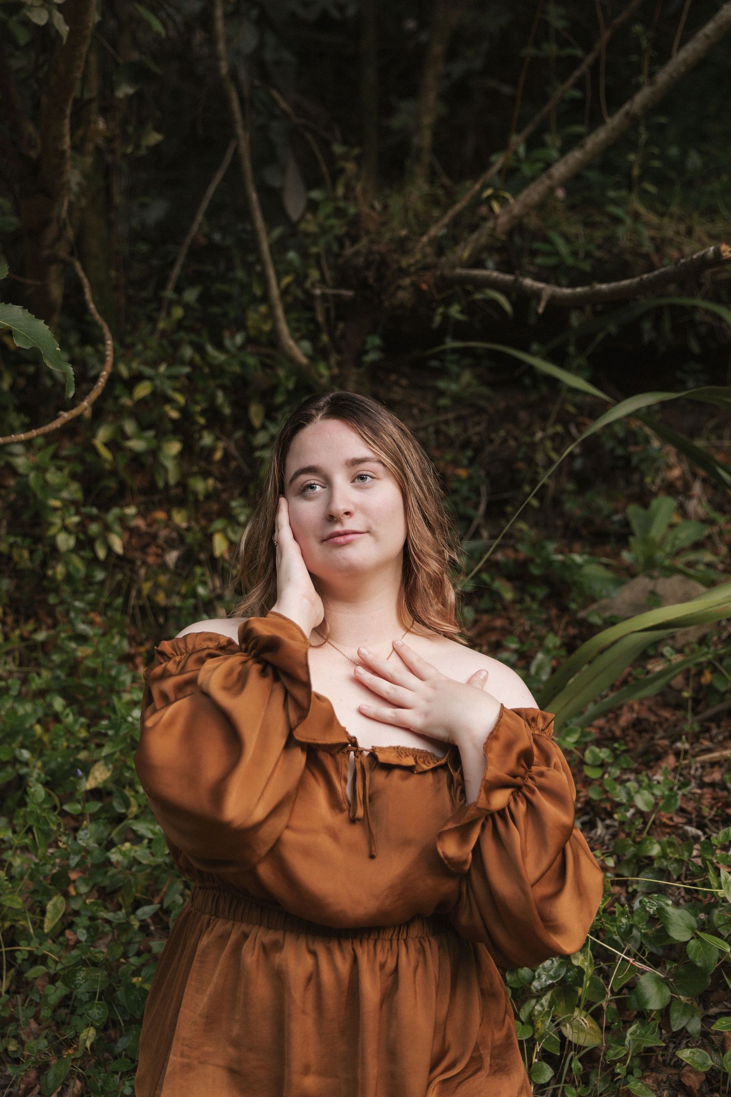 Romantic portrait series featuring a brown prairie dress with ruffled collar in a forest setting.