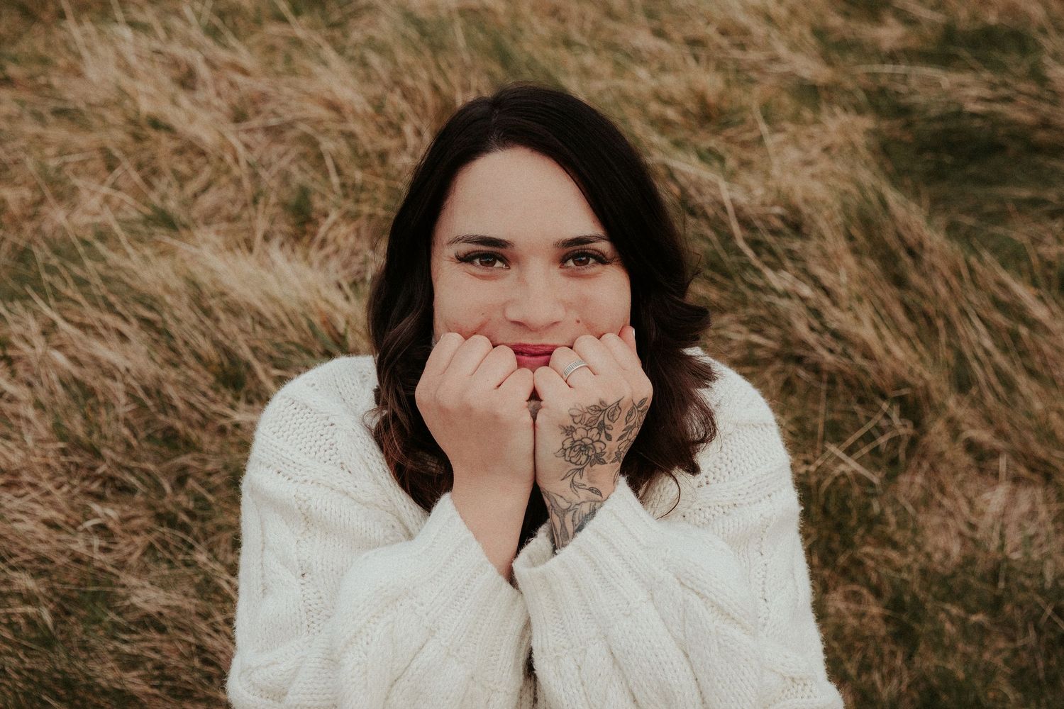Artistic portrait series showing emotional expressions against a natural outdoor setting.
