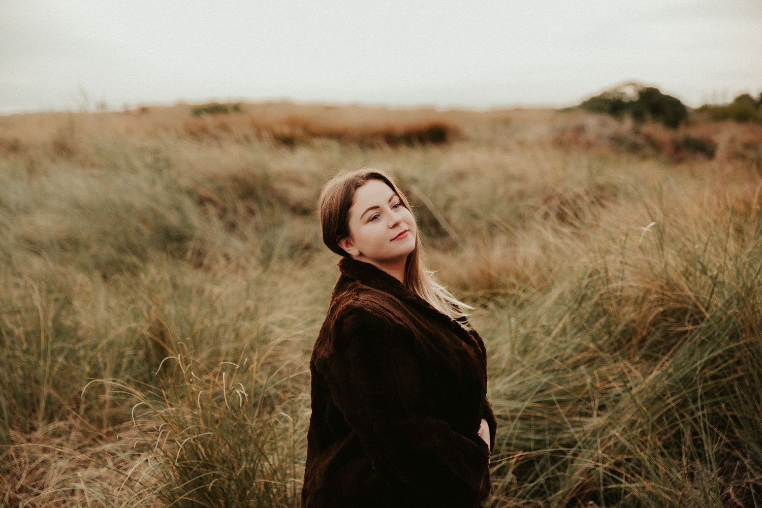 Expressive moments photographed in rustic outdoor setting with natural lighting.