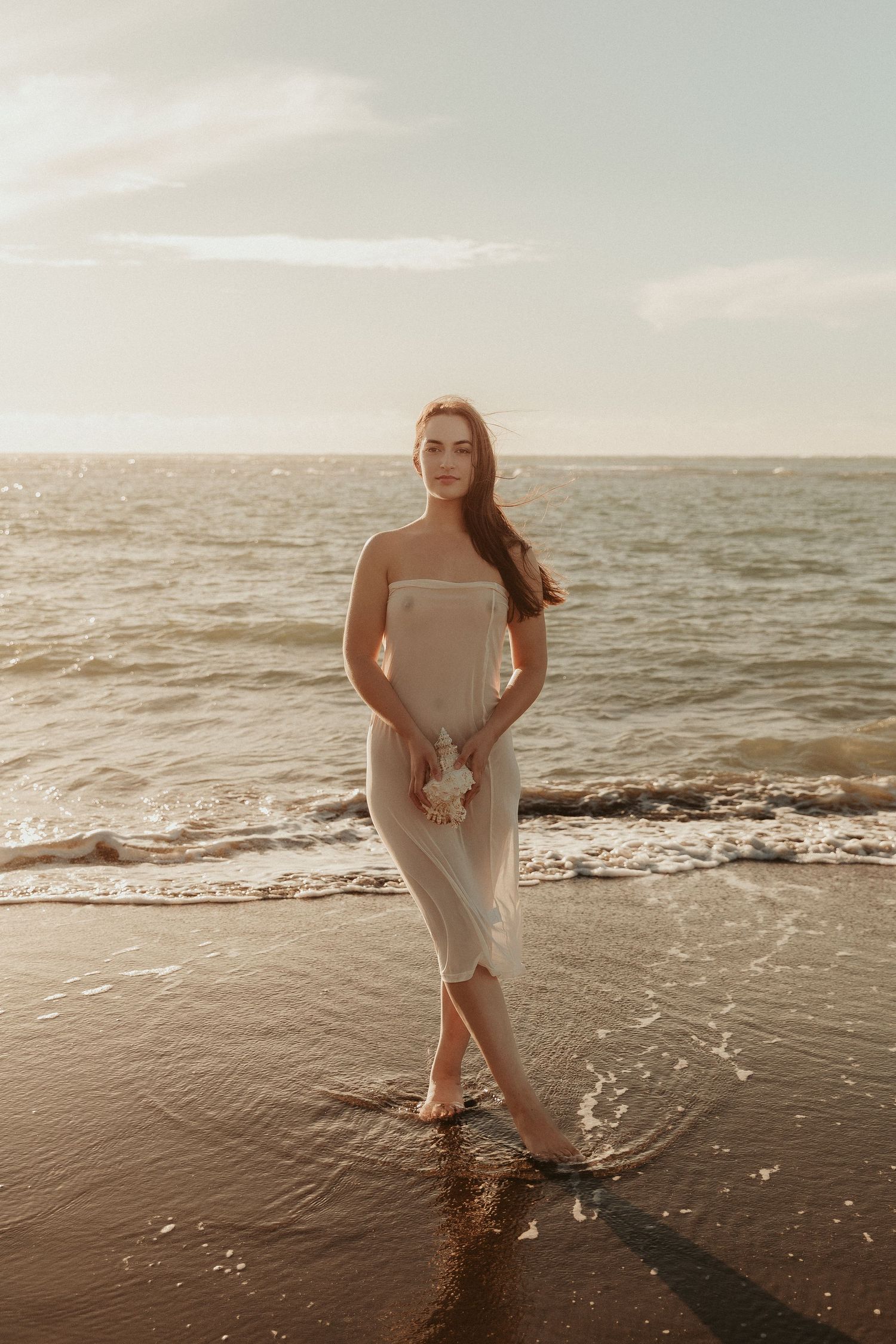 Artistic beach portraits with gentle waves and soft evening sunlight.