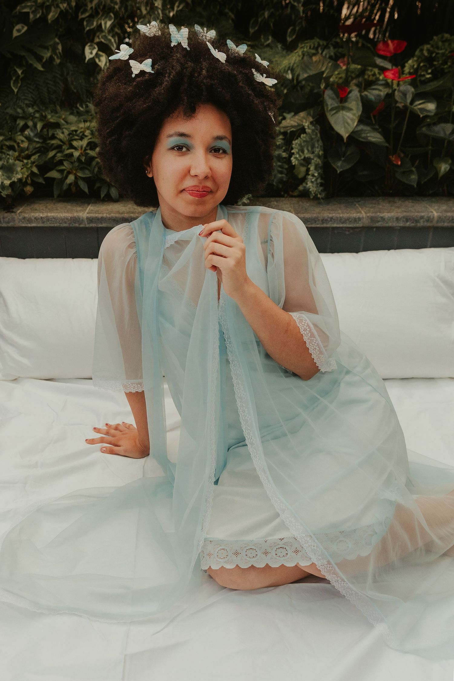 Dreamy garden portrait session with white dress and delicate styling.