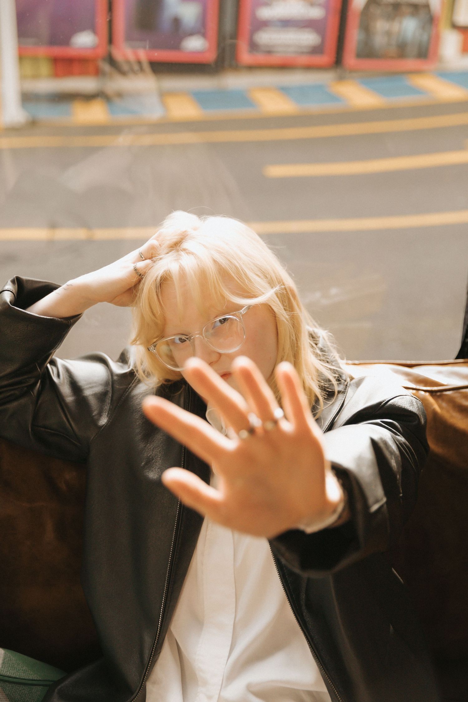 A sequence of photos showing hands making dramatic gestures in front of a blurred background.