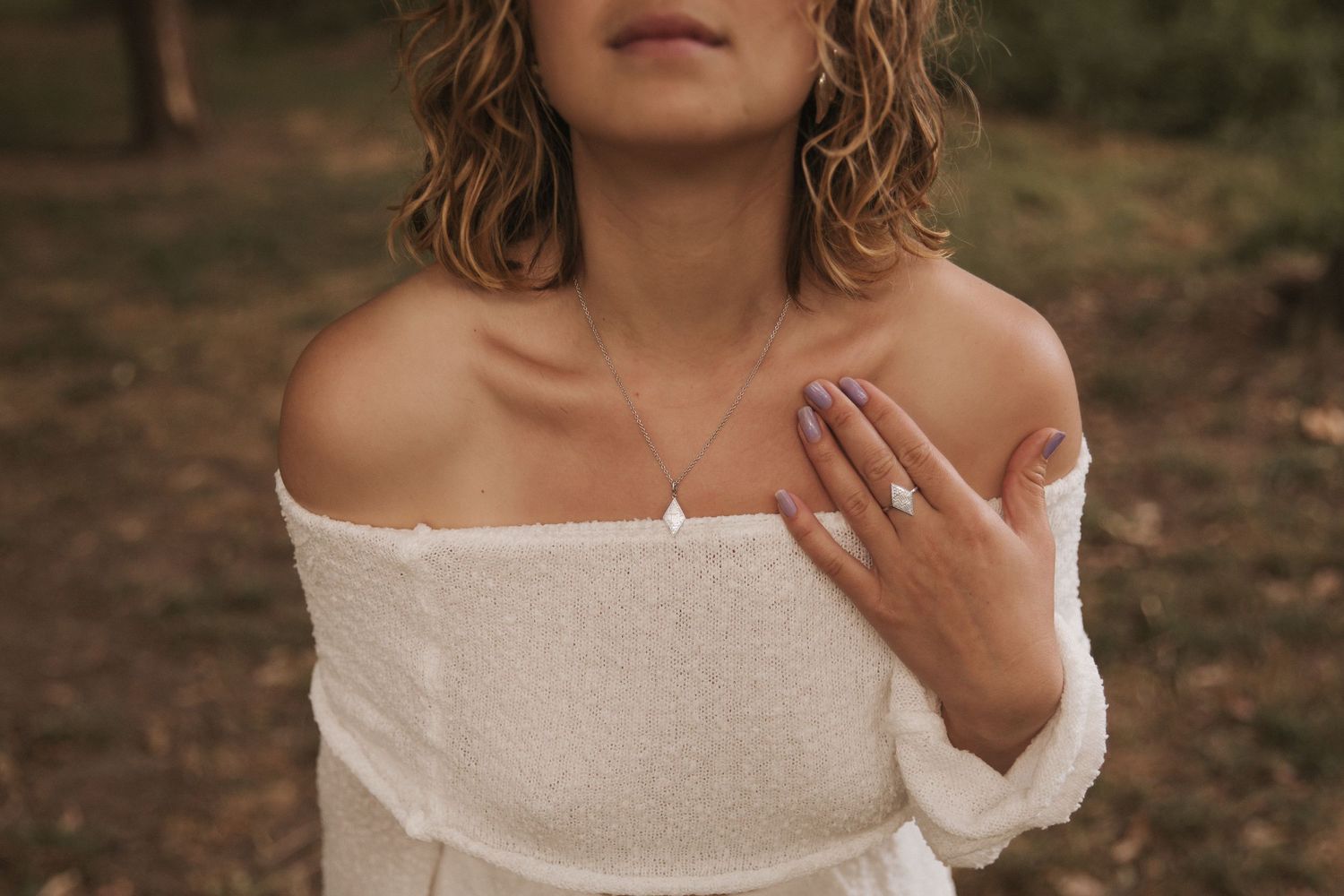 Close-up portrait series showing natural expressions in white off-shoulder top.