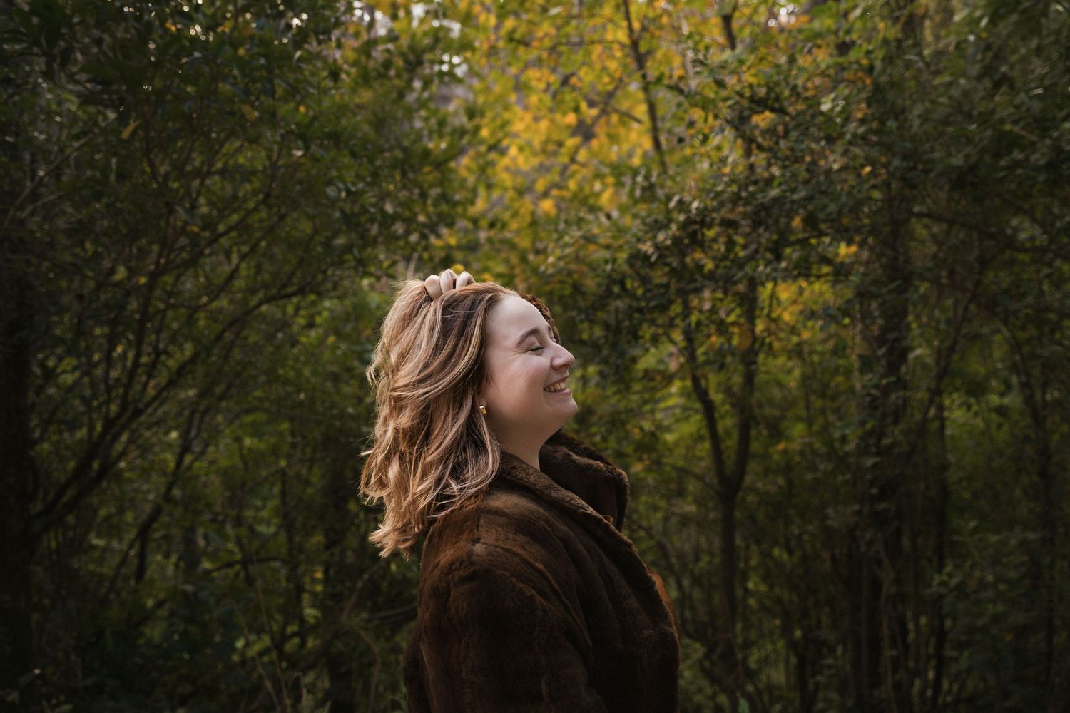 Artistic outdoor portrait series with golden hour lighting in wooded setting.