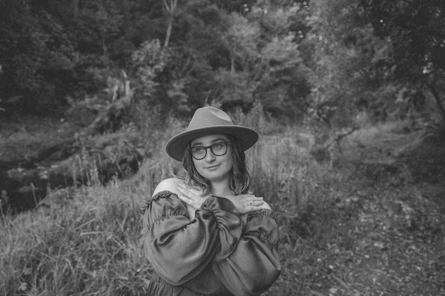 Monochrome nature photography capturing movement and light in forest setting.