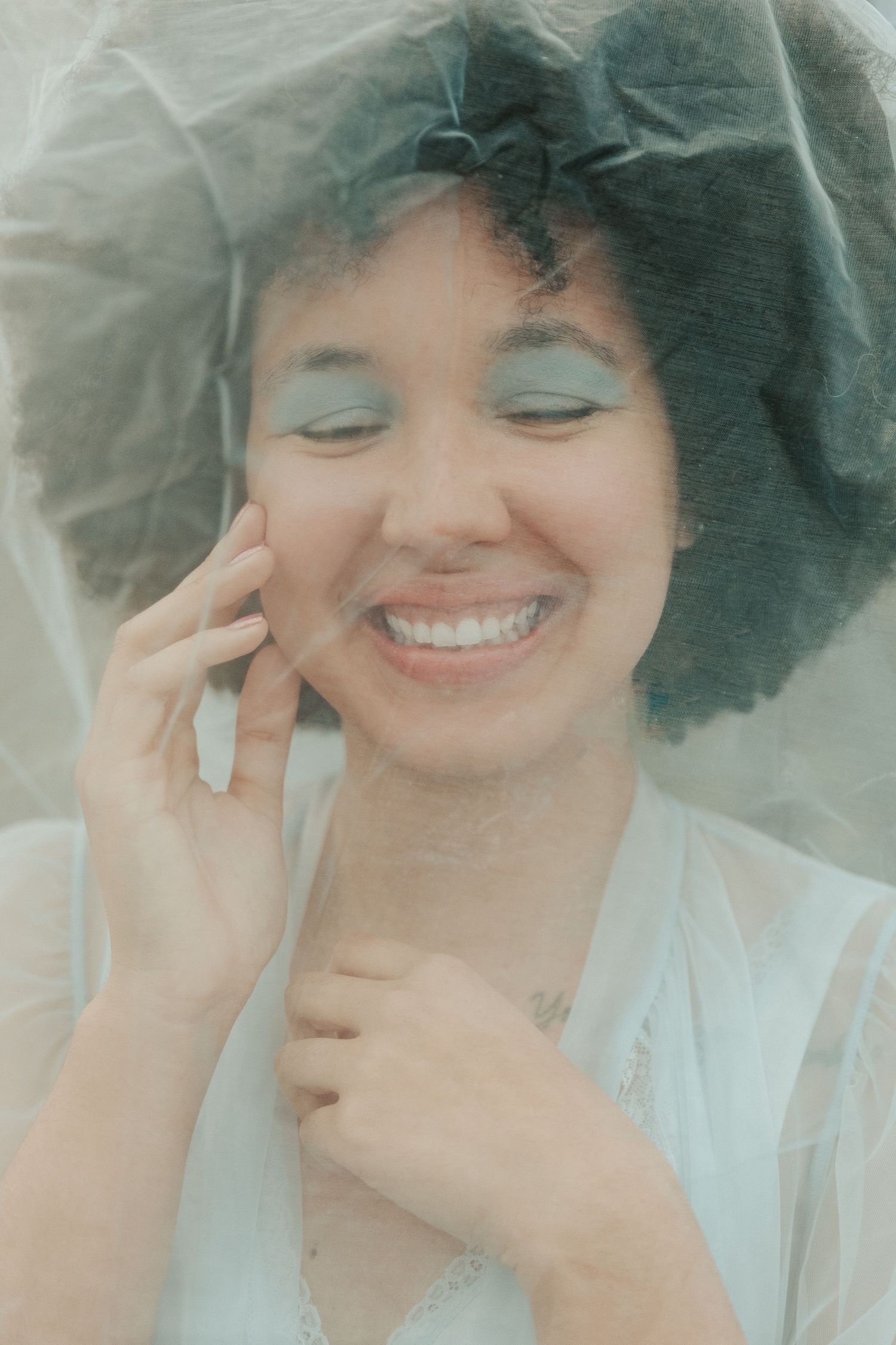 Soft, dreamy portraits with vintage veil and natural expressions.