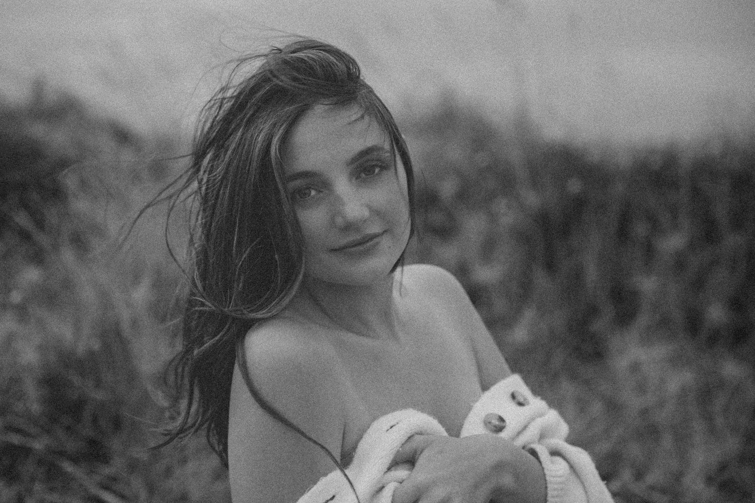 Black and white maternity portrait showcasing natural beauty and emotion.