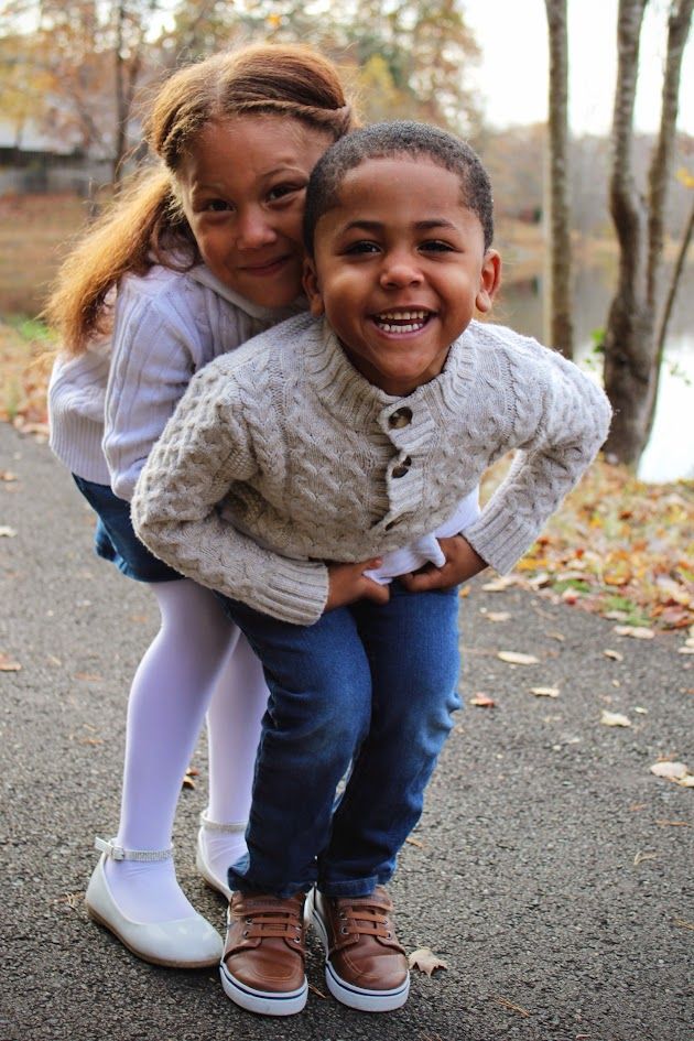 Candid fall photos showing joyful moments in casual sweaters and jeans.
