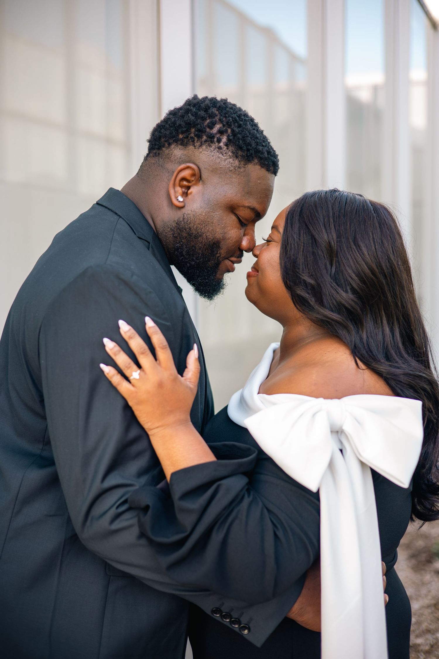 A romantic couple in formal attire share intimate embraces in a series of four tender wedding photos.