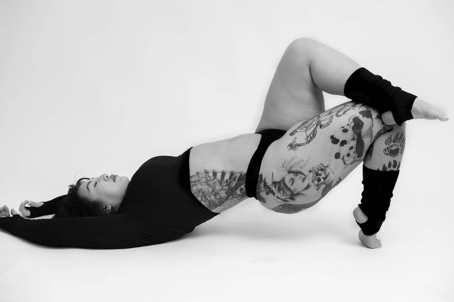Black and white artistic portrait series showing a person lying down in different graceful reclining poses.