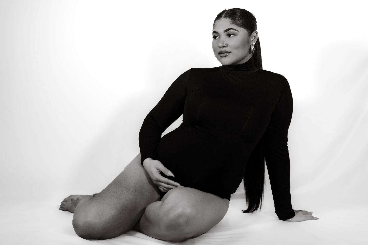 Black and white artistic nude photography series showing graceful body poses against a plain white background.