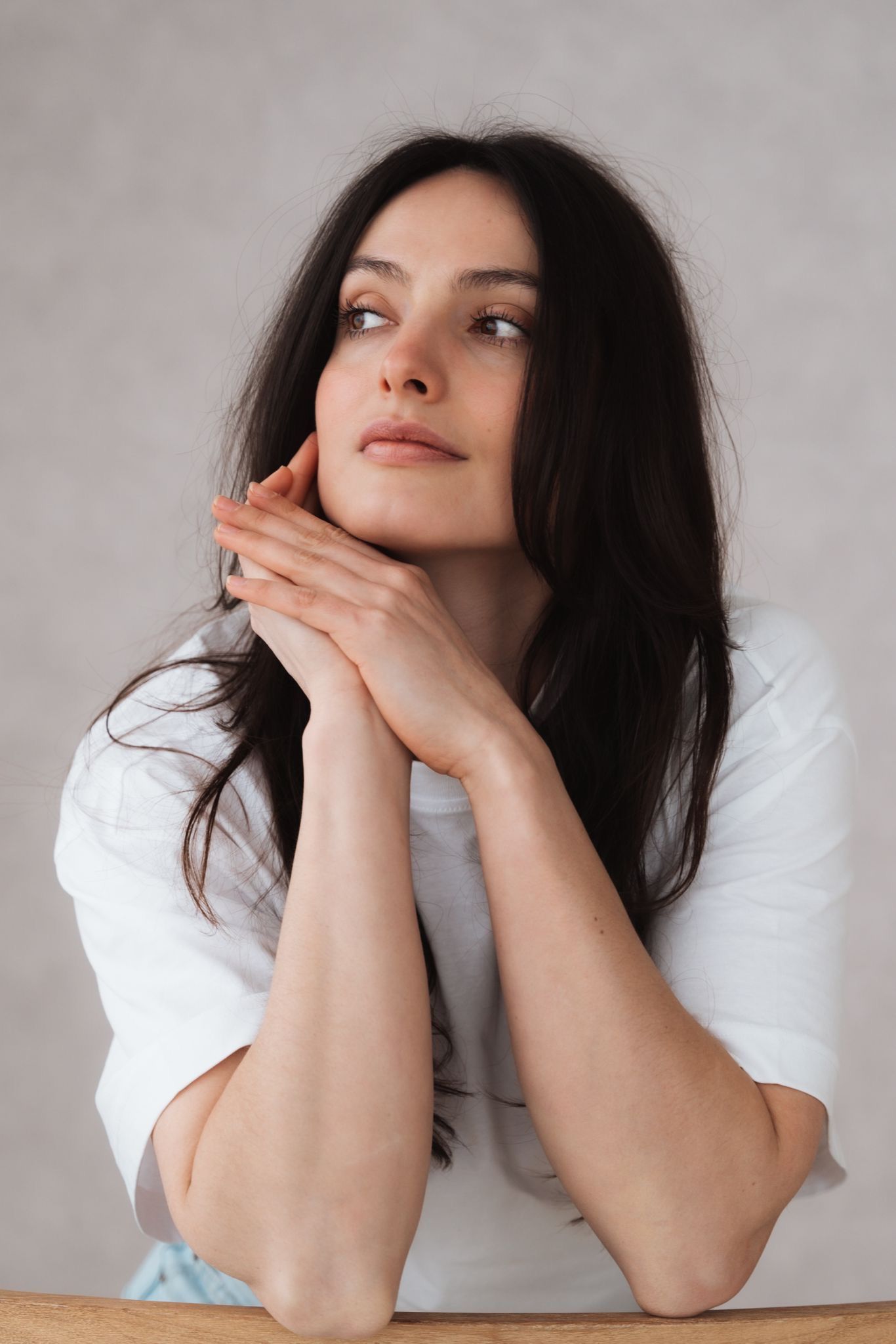 Artistic portrait series showing intimate close-up poses against a light gray background.