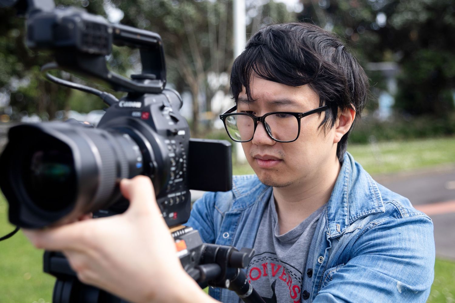 David, owner of DFU Photos, holding a camera during a videography job