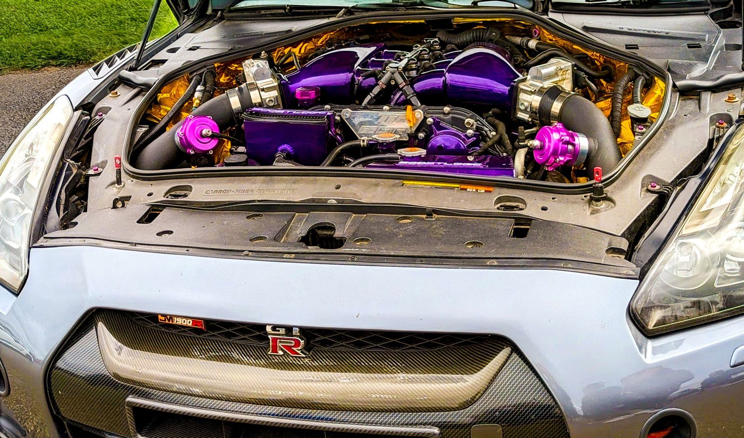Modified car engine with polished parts and purple highlights on display Rotherham Photography air shows
