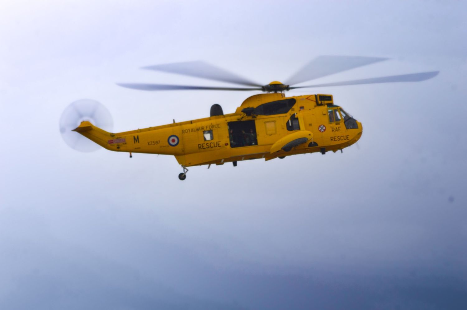 Yellow rescue helicopter flying at a UK air show during sunset Rotherham Photography air shows