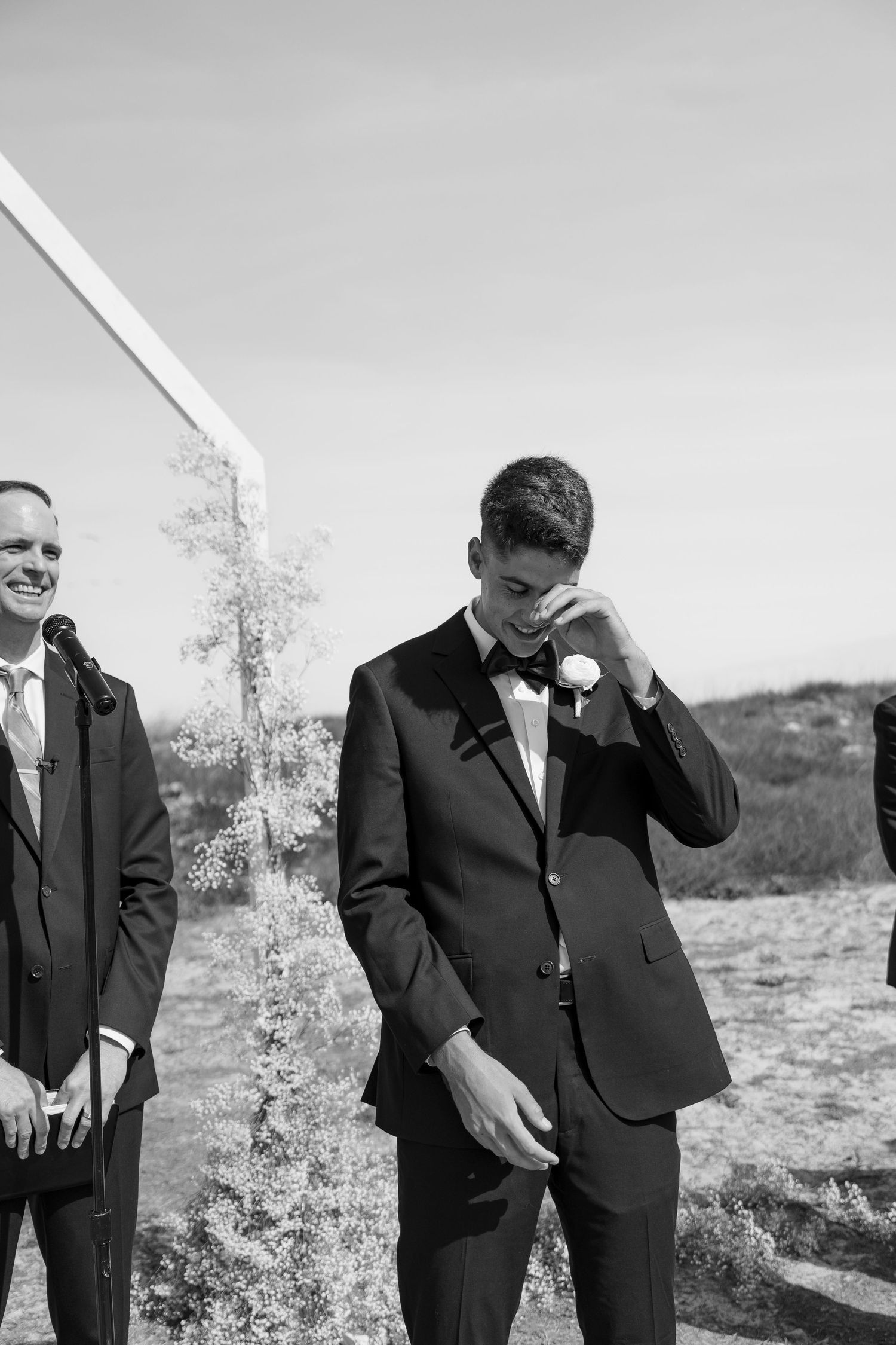 Virginia Beach and Norfolk wedding photographer and faith-based business owner capturing grooms reaction to bride walking down the aisle