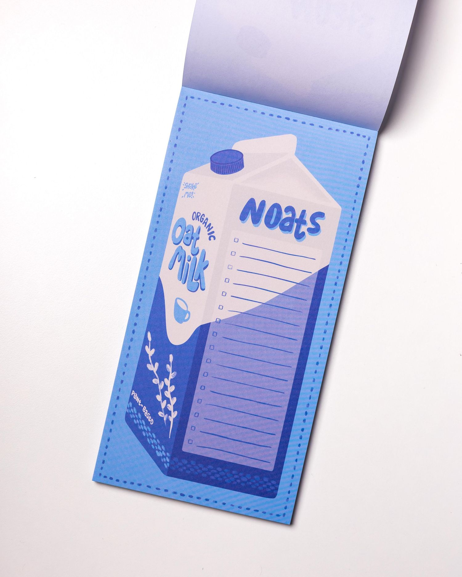 Blue and white decorative sticky note pads with floral designs and lined writing spaces arranged in a gradient display.