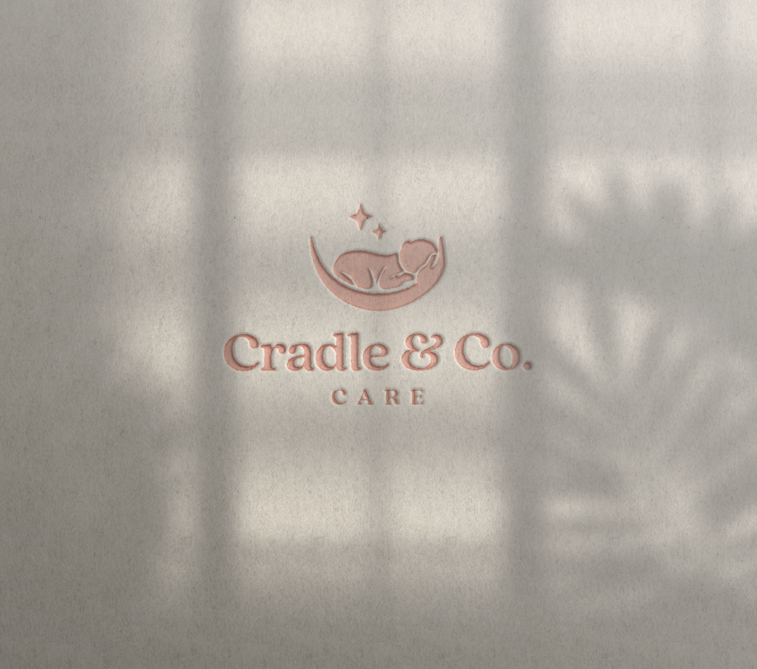 Cradle & Co. Care logo featuring a sleeping baby in a cradle with stars, displayed on a textured wall.