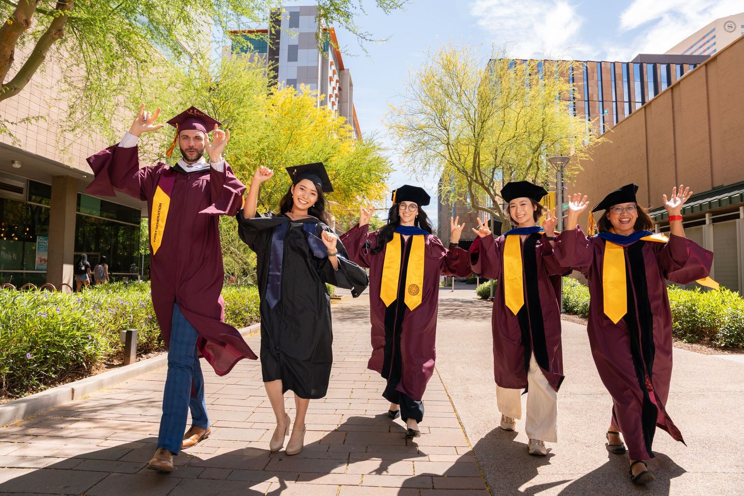 group of students walking and celebrating together