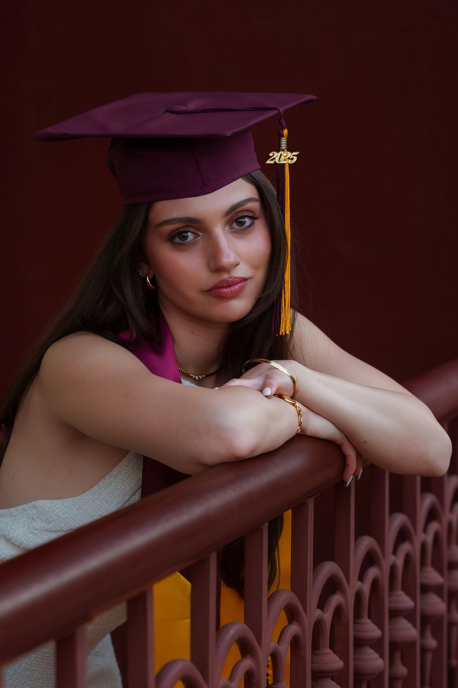 girl posing in her graduation cap