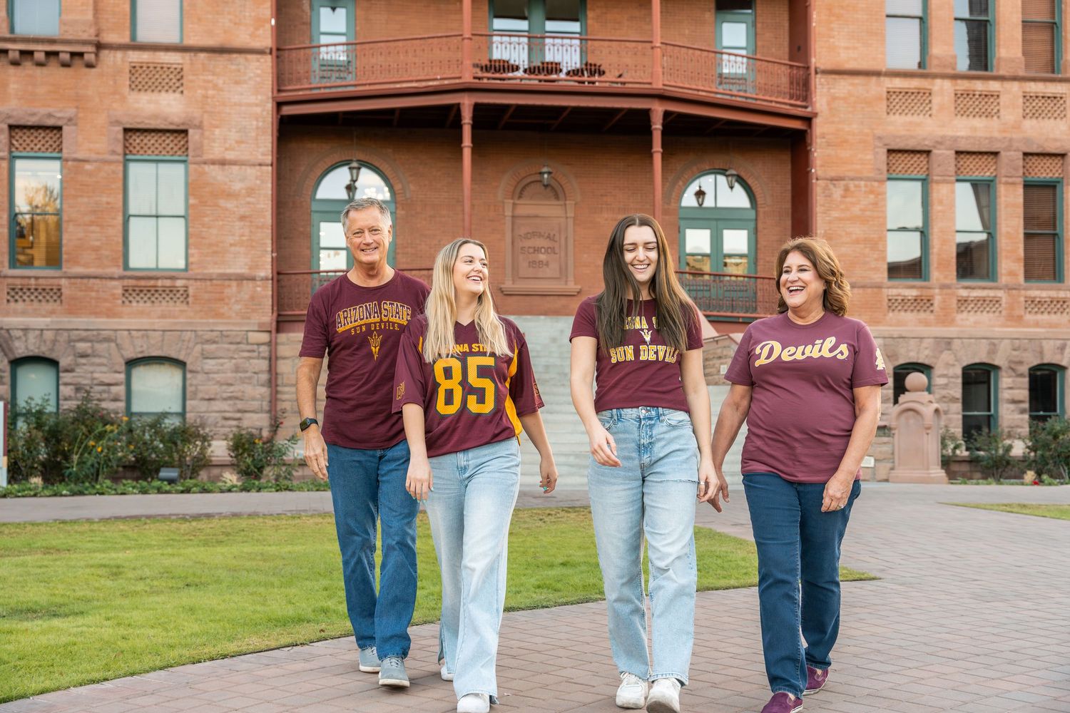 family walking outdoors outside of oldmain building on ASU tempe campus