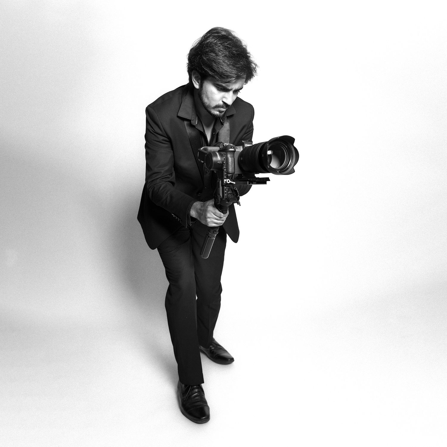 Shivam Barthwal, Vancouver wedding photographer and filmmaker, holding a camera on gimbal