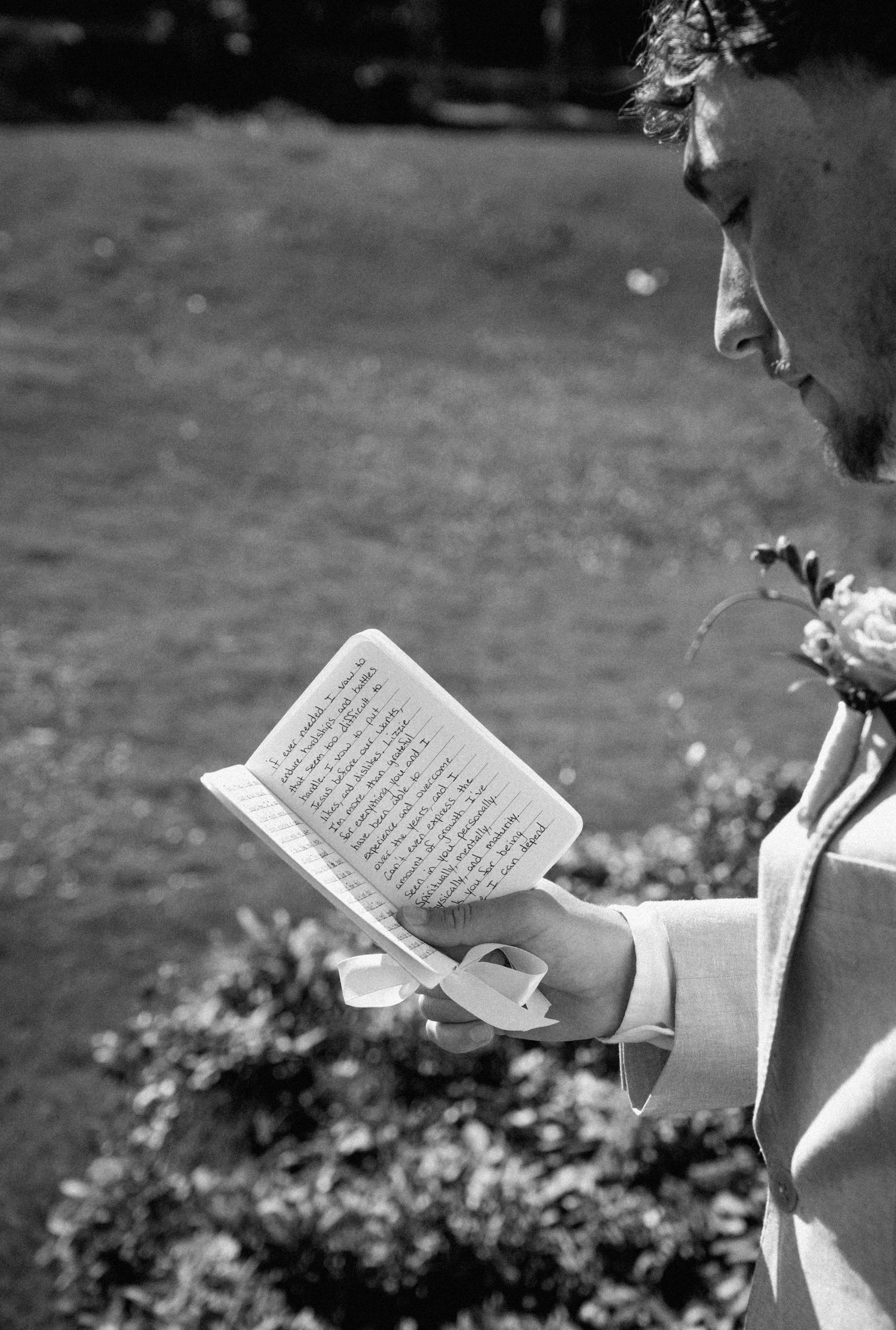 Groom reading vows on his wedding day on Amelia Island, Florida