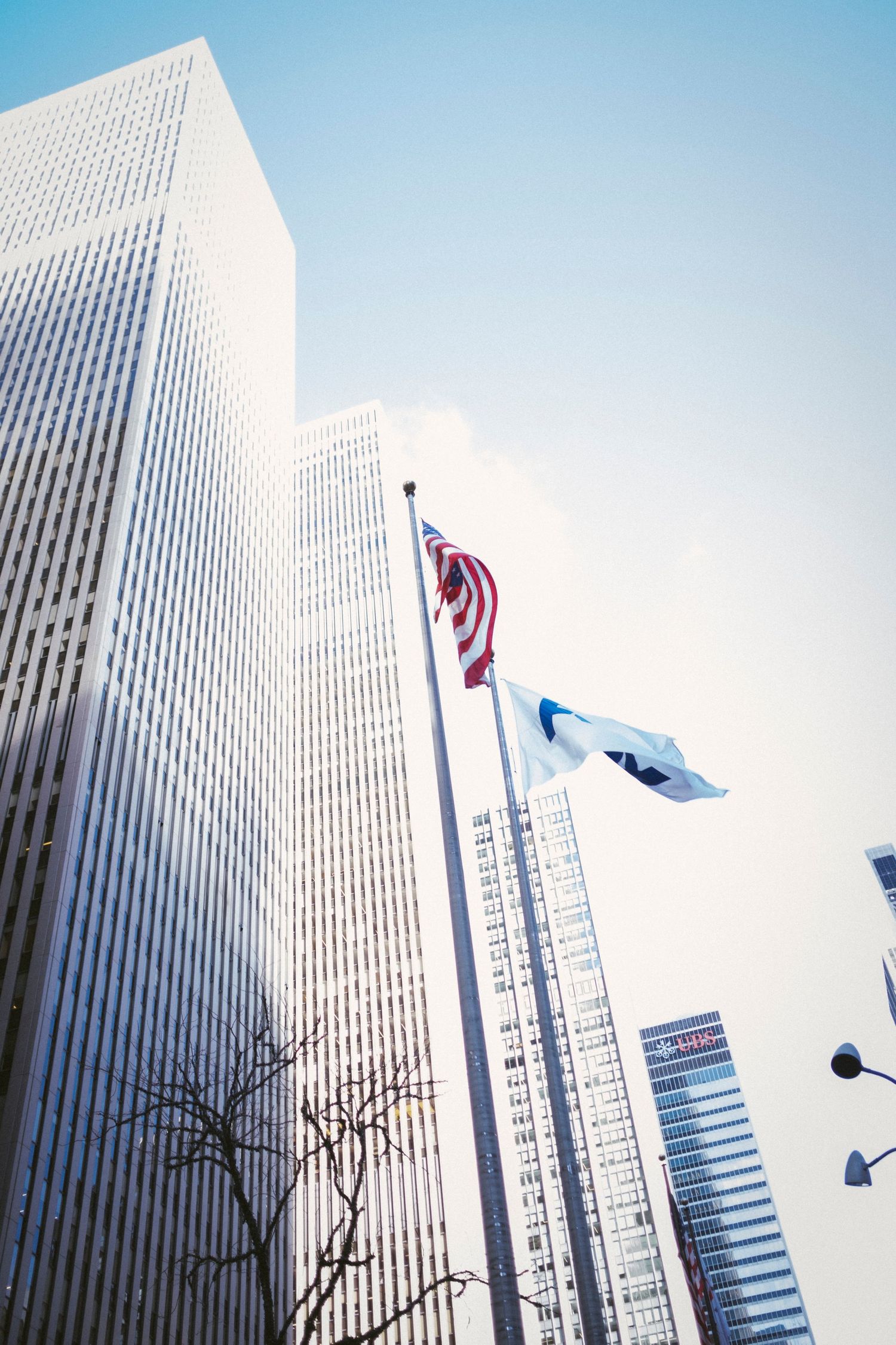 New York City skyline photo with 2 flags flying
