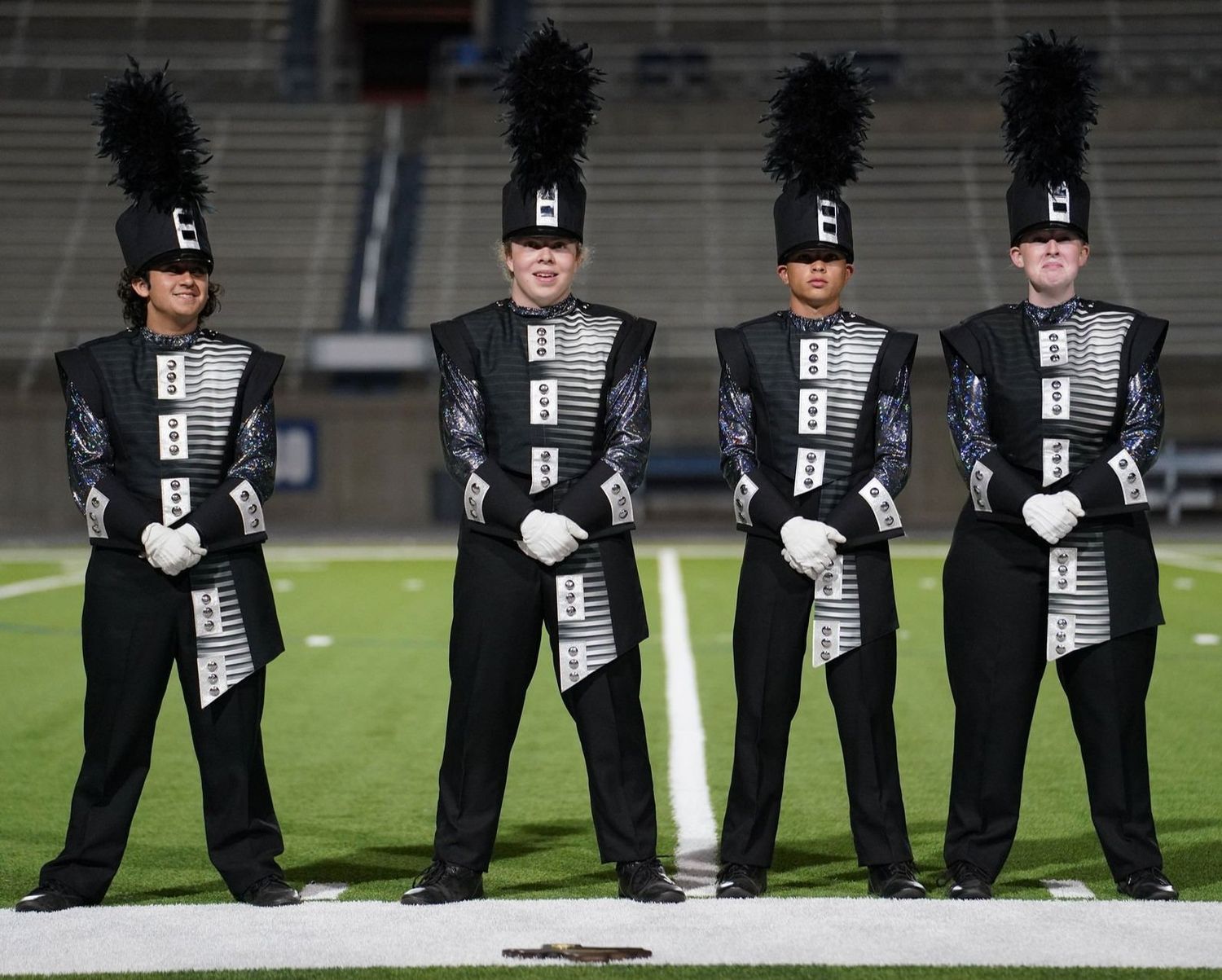 Drum majors collectively realizing they just advanced to state. UIL Area A finals, Odessa, TX, October 23, 2021.