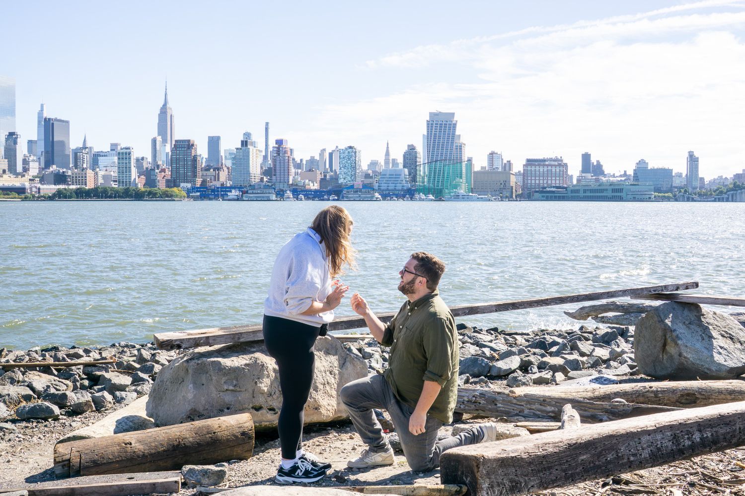 proposal with NYC skyline in the background