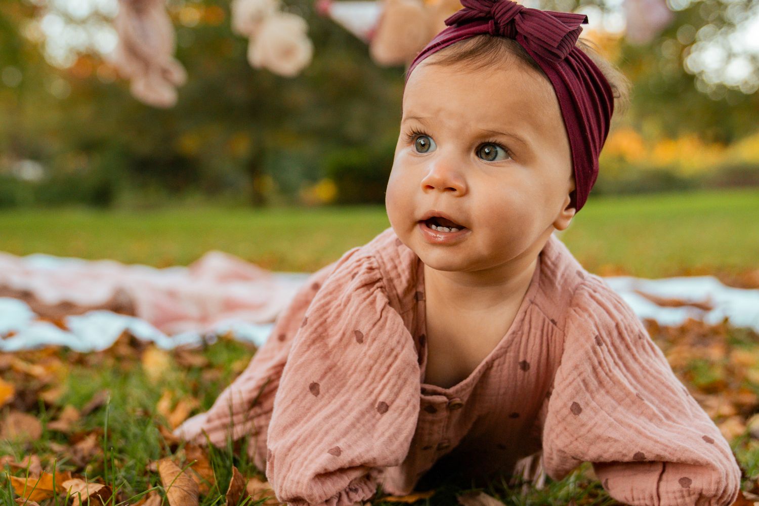 baby girl with fall background