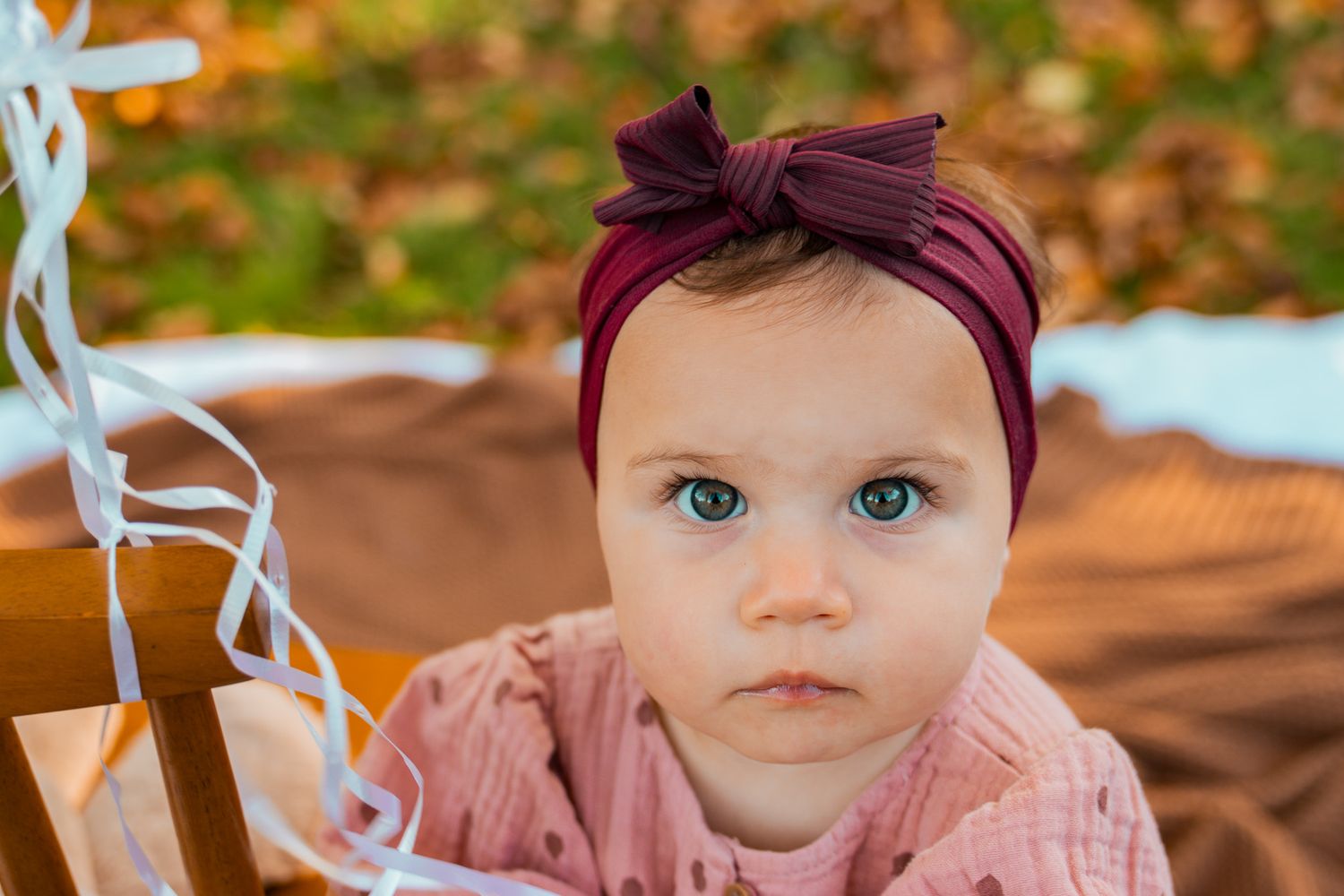 baby girl with fall background