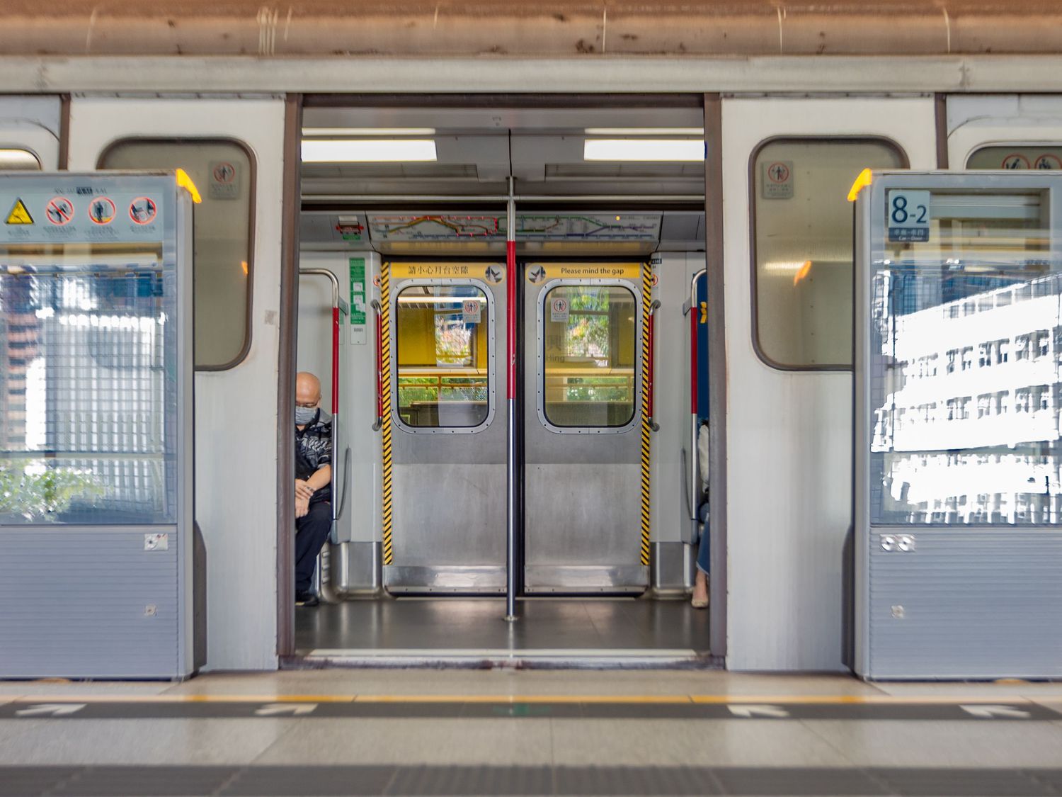 Empty subway train car doors open at a station platform.