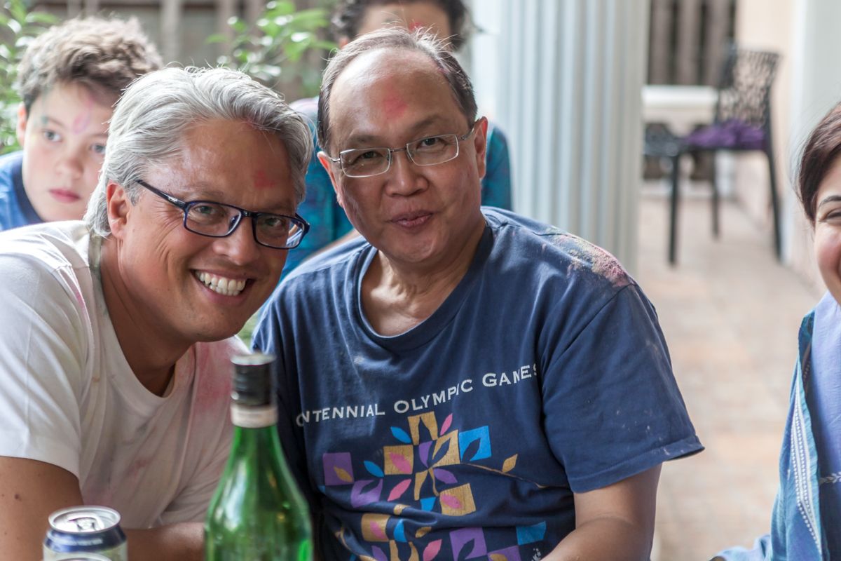 Friends enjoying a casual outdoor gathering on patio.