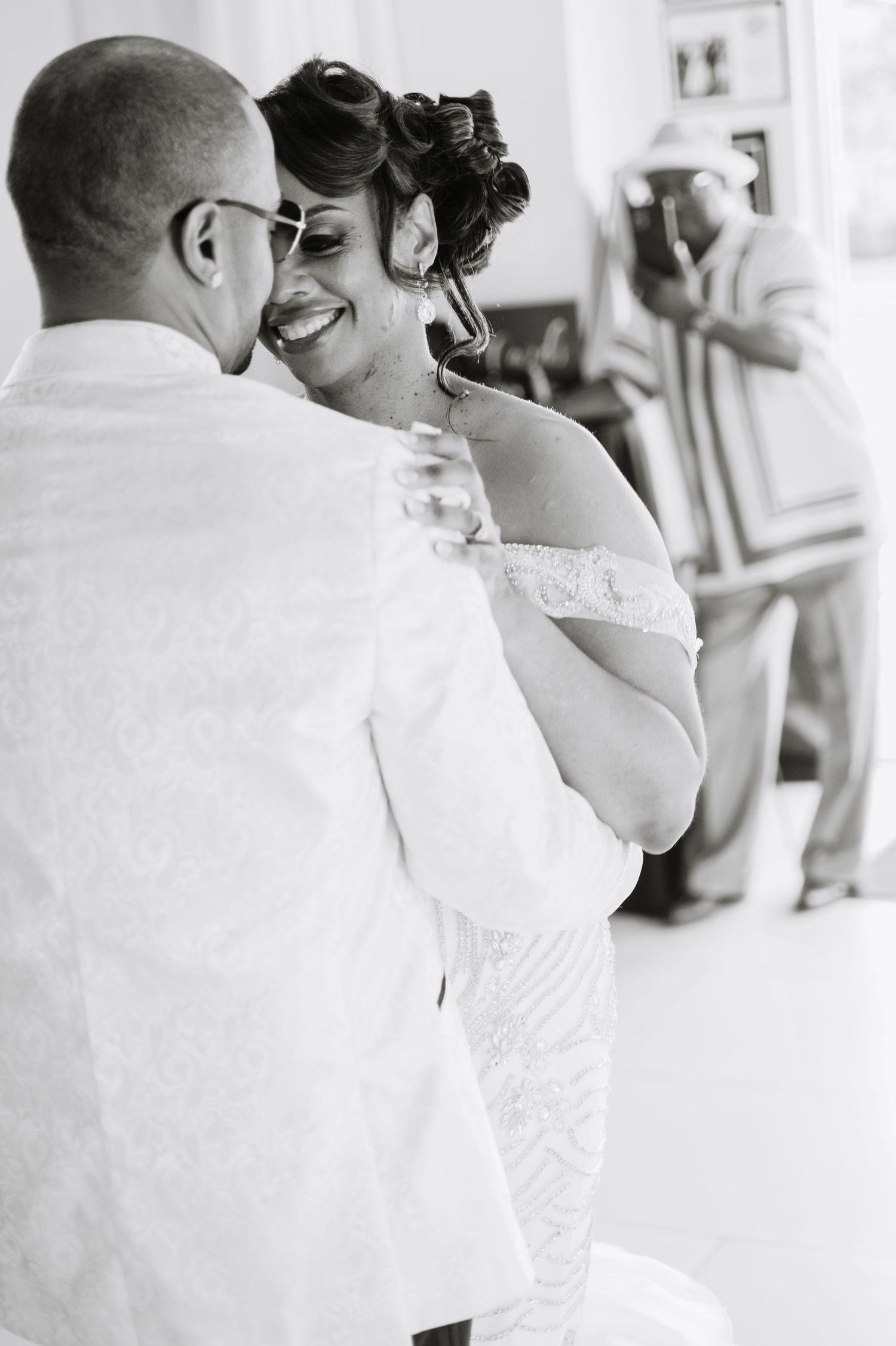 Intimate black and white wedding portraits showing tender moments.