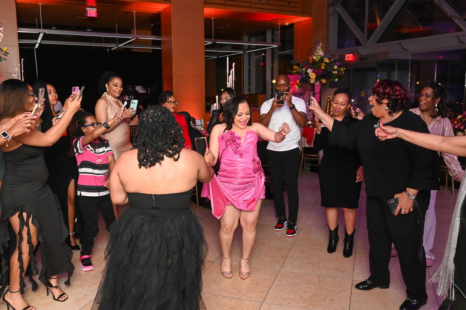 Wedding reception dance floor scenes with guests in formal attire under colored lighting.