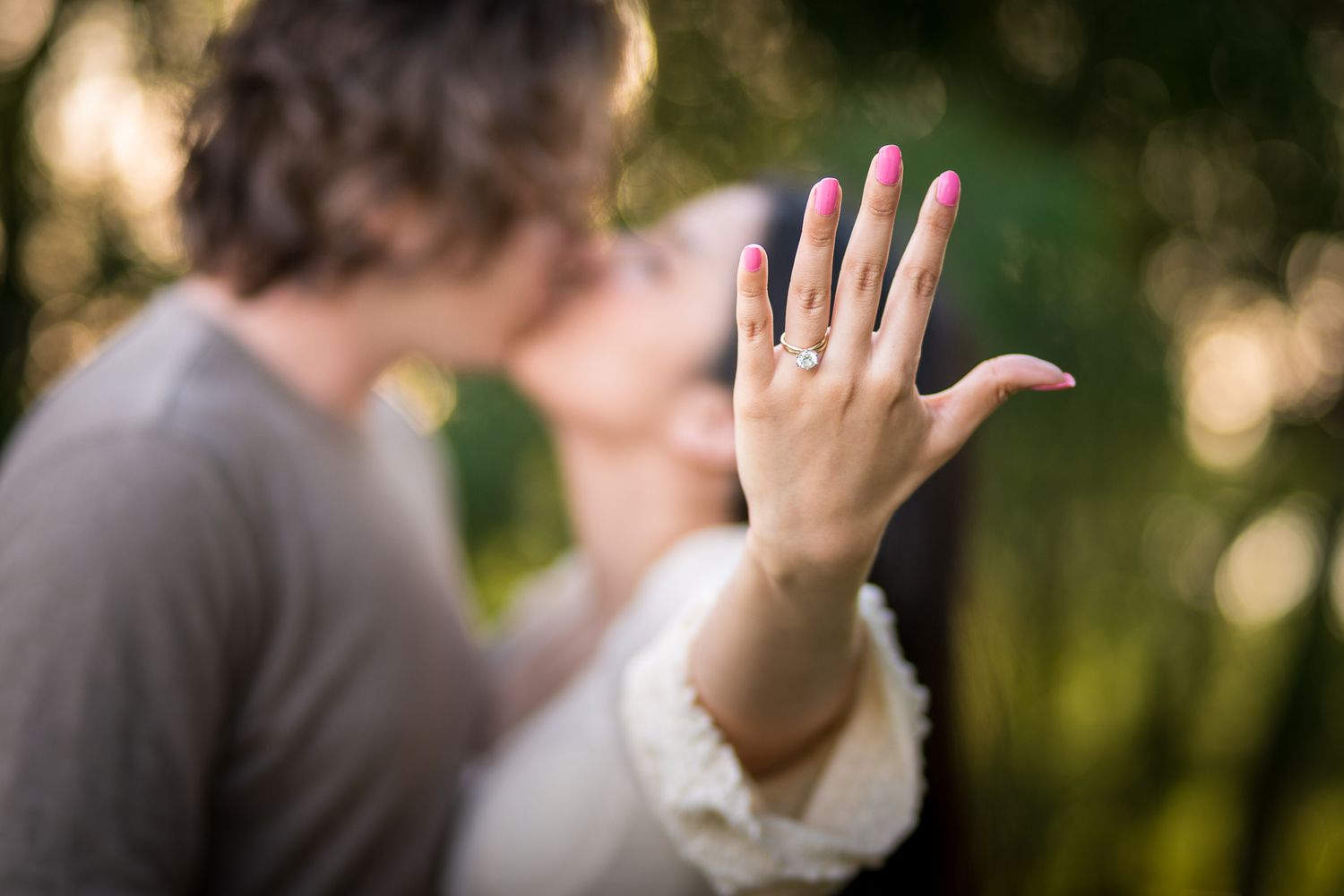 A sequence showing hands raised in celebration during a proposal moment.