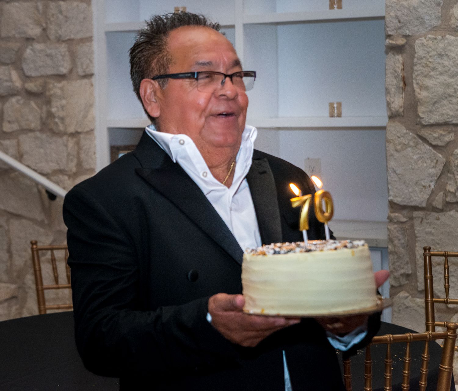 A sequence of photos showing someone blowing out birthday cake candles in a dimly lit room.