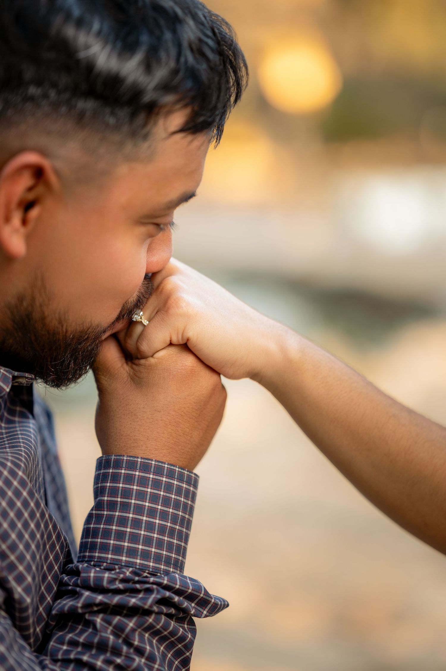 Close-up sequence of a romantic proposal moment showing hands and emotions in warm lighting.