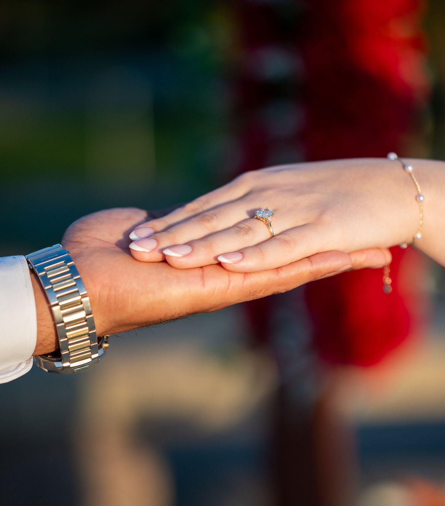 Close-up sequence of hands showing an engagement ring proposal moment.