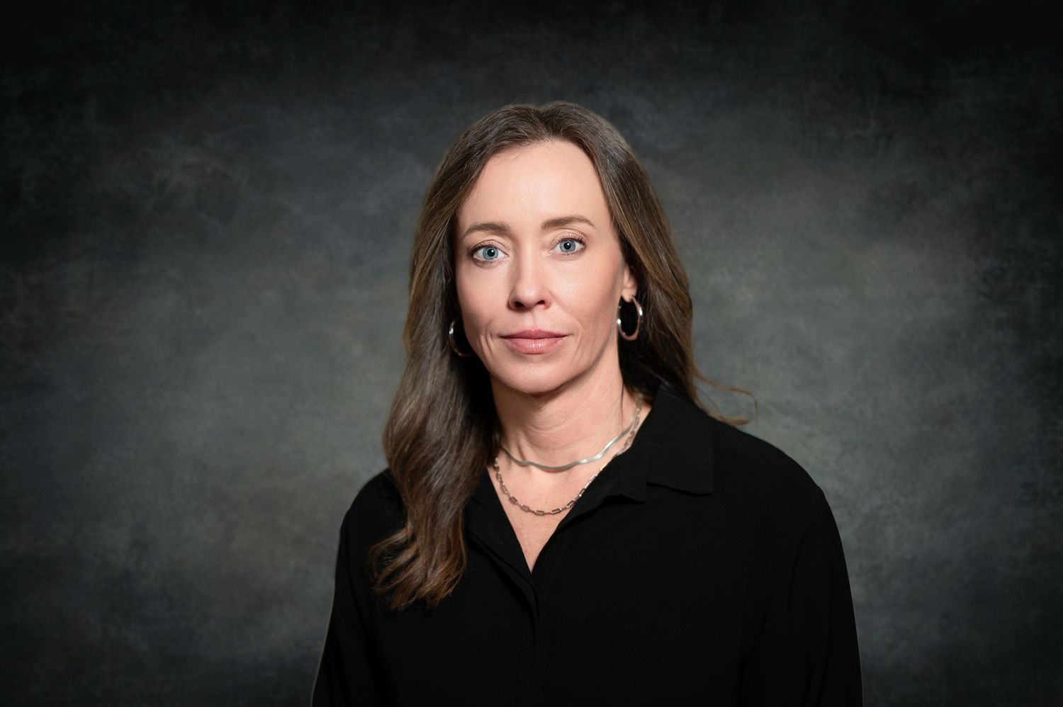 A series of six moody black and white headshots against a dark textured background.