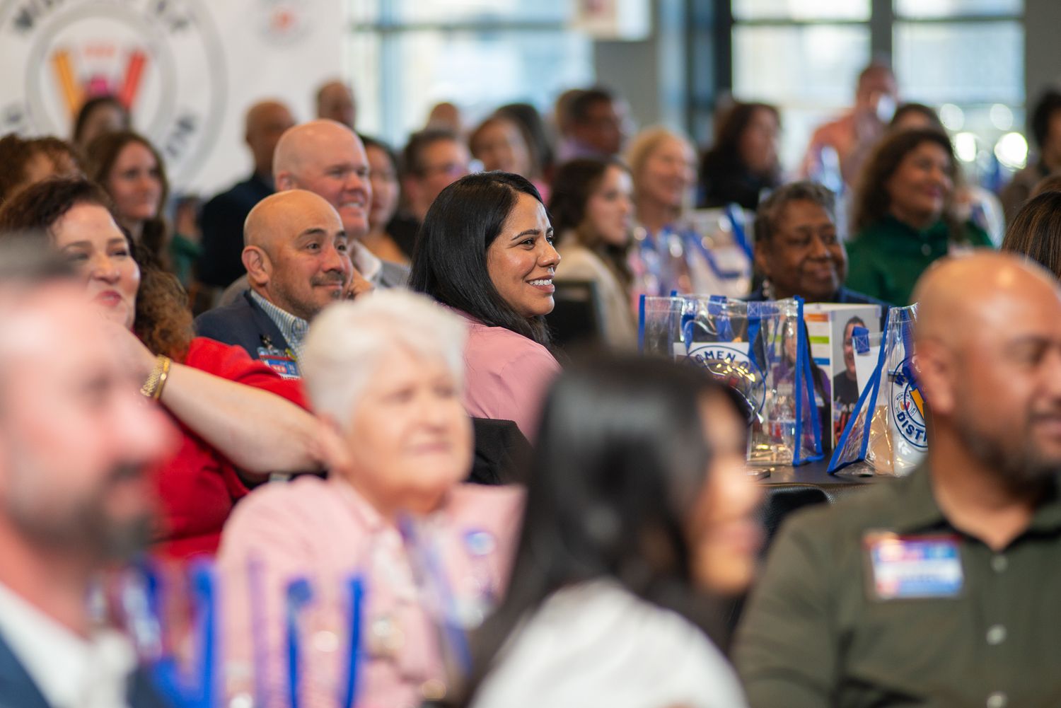An engaged audience watches intently during a live performance or presentation.