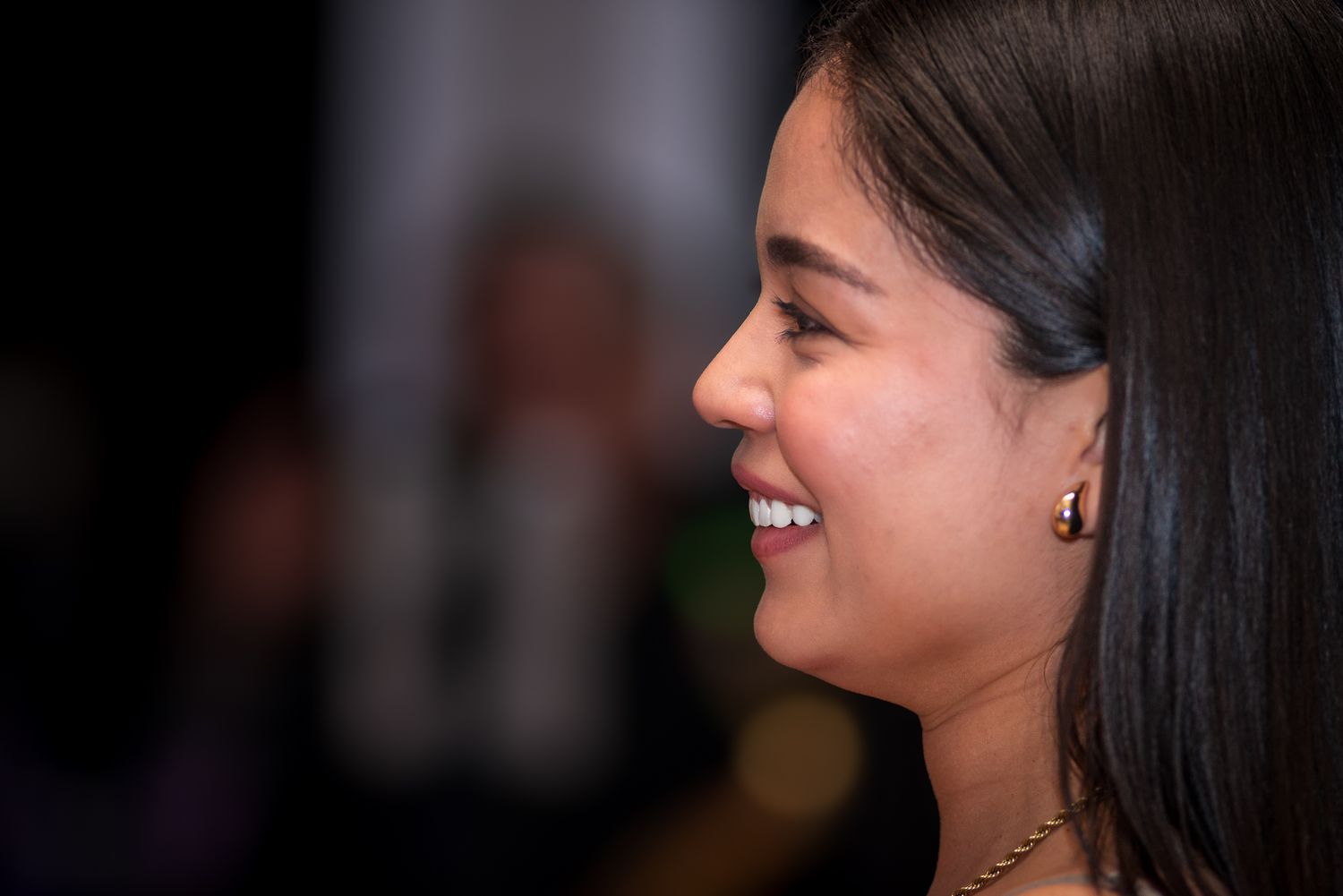 Close-up shots capturing genuine smiles and expressions at an event.