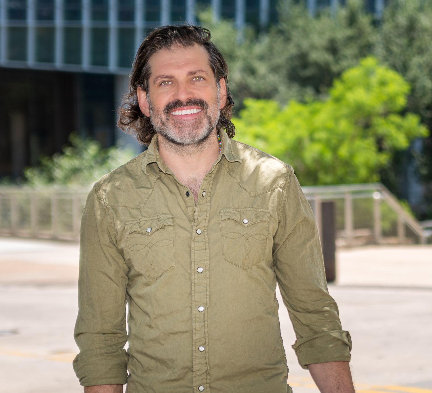 Professional outdoor portrait series showing different angles in casual business attire.