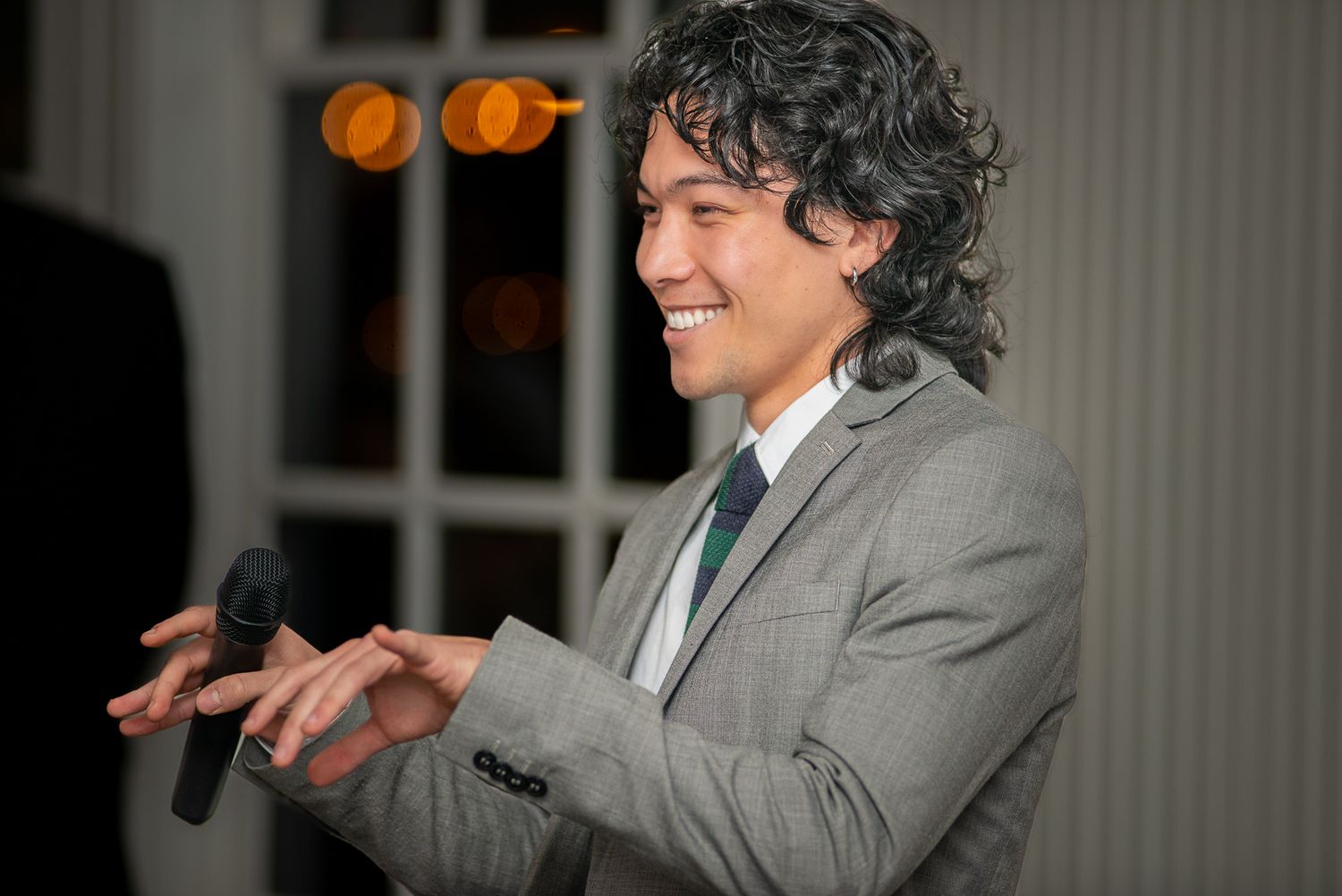 Speaker presenting on stage at an entertainment event.